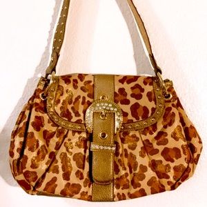 A vintage cheetah print purse